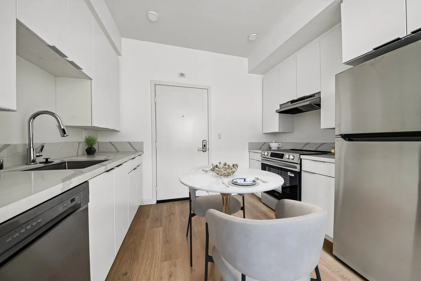 Modern kitchen with granite countertops and GE appliances