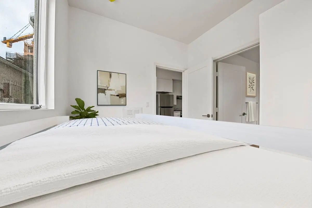 Bright bedroom with white finishes