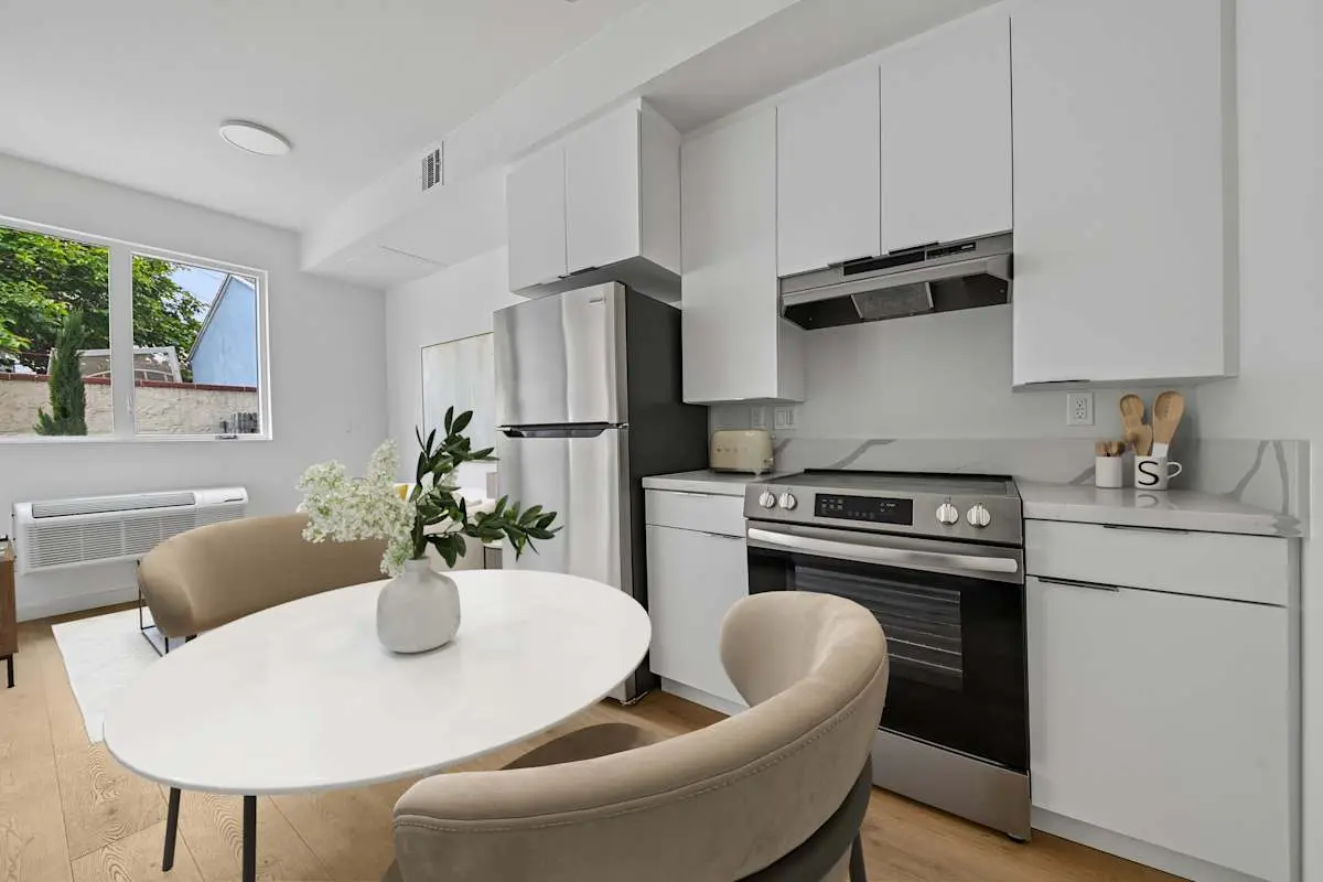 Kitchen and living space with dining seating
