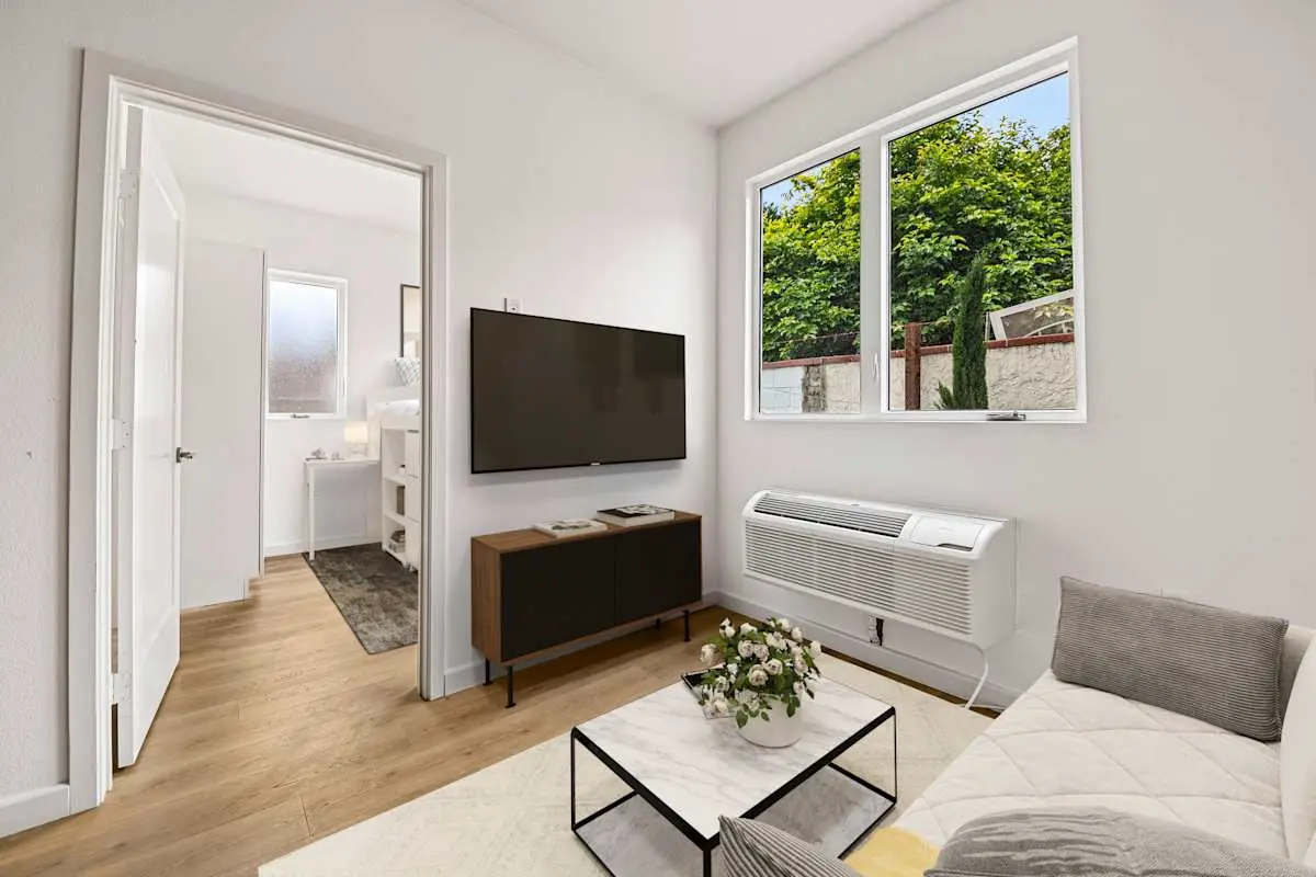 Living room with sofa and view toward the bedroom