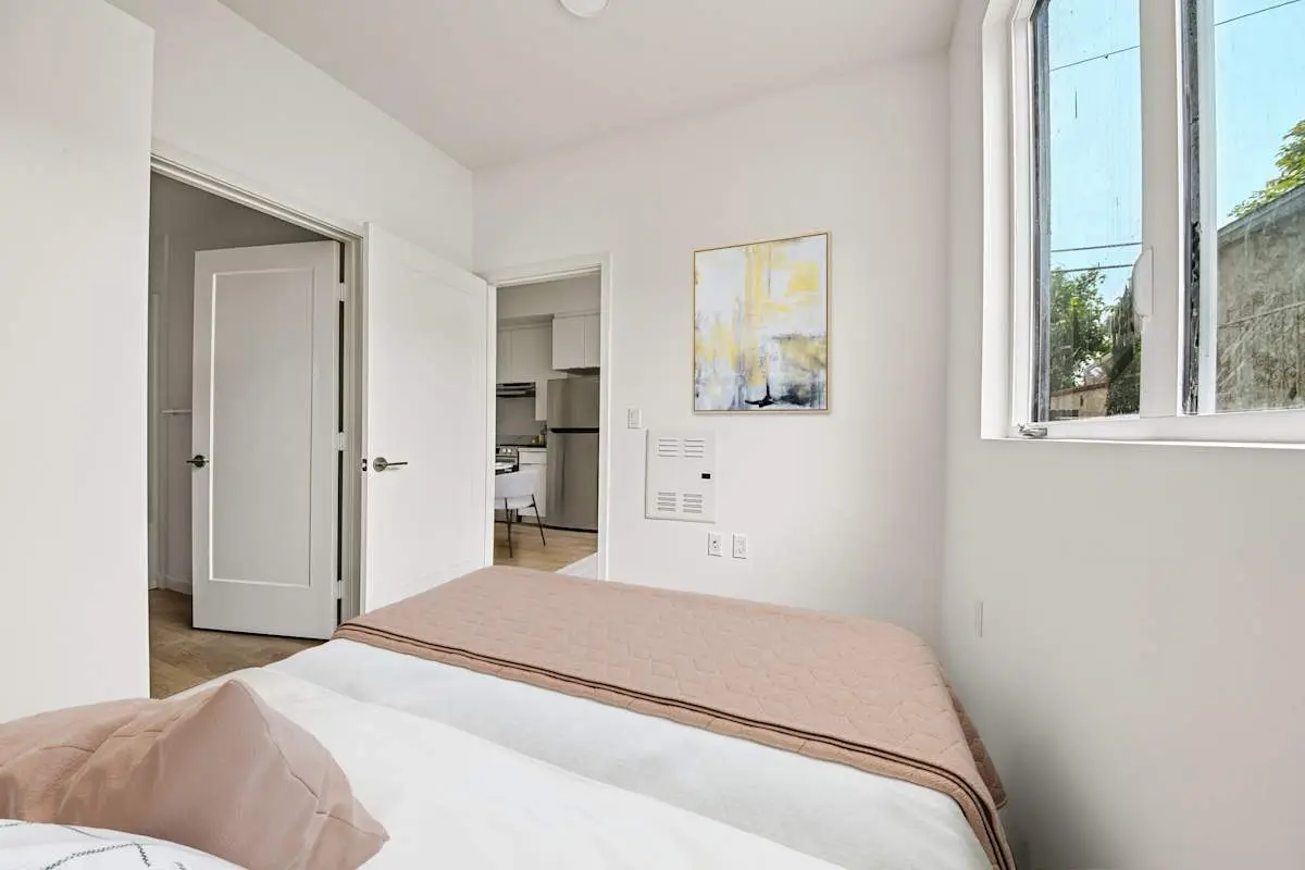 Bedroom with natural light and wall art